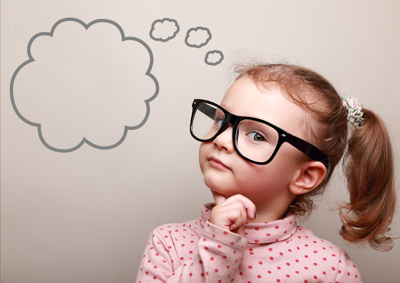 Cute thinking kid girl in glasses with empty bubble looking